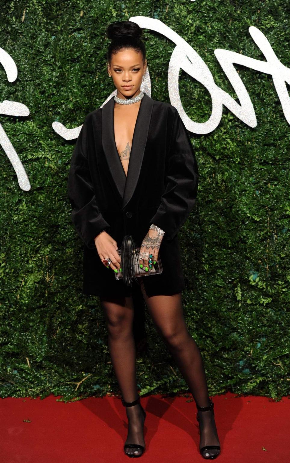 16P Rihanna braless showing cleavage at the British Fashion Awards in London