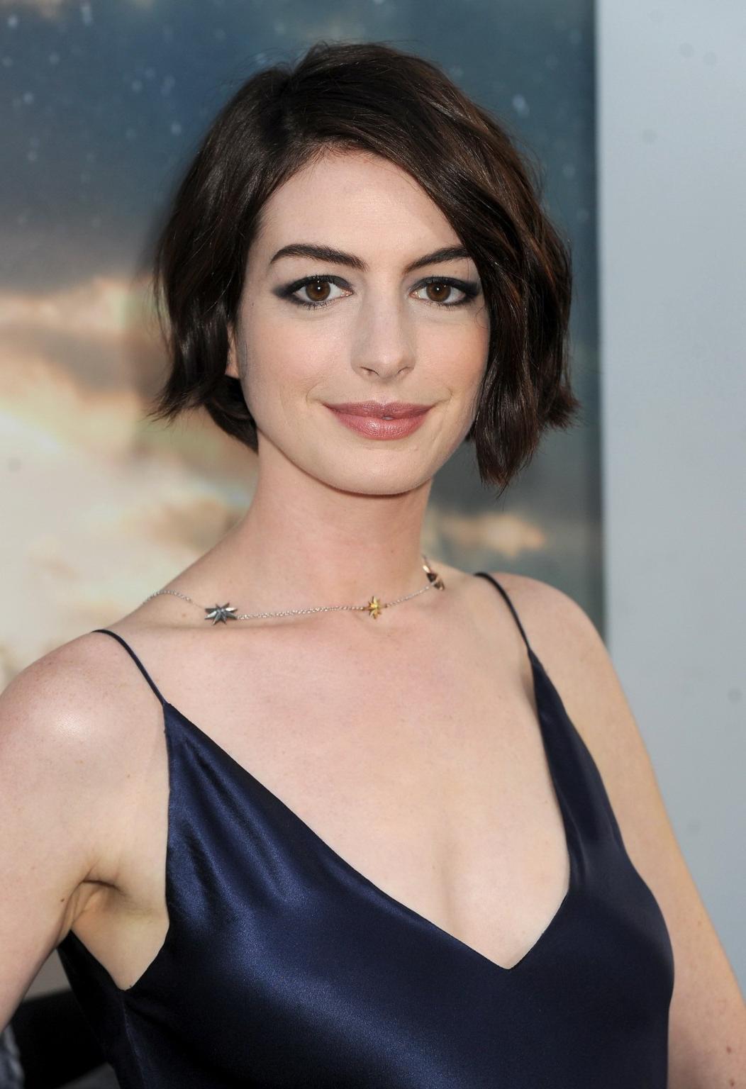 16P Anne Hathaway braless showing big cleavage in a backless purple dress at the Int
