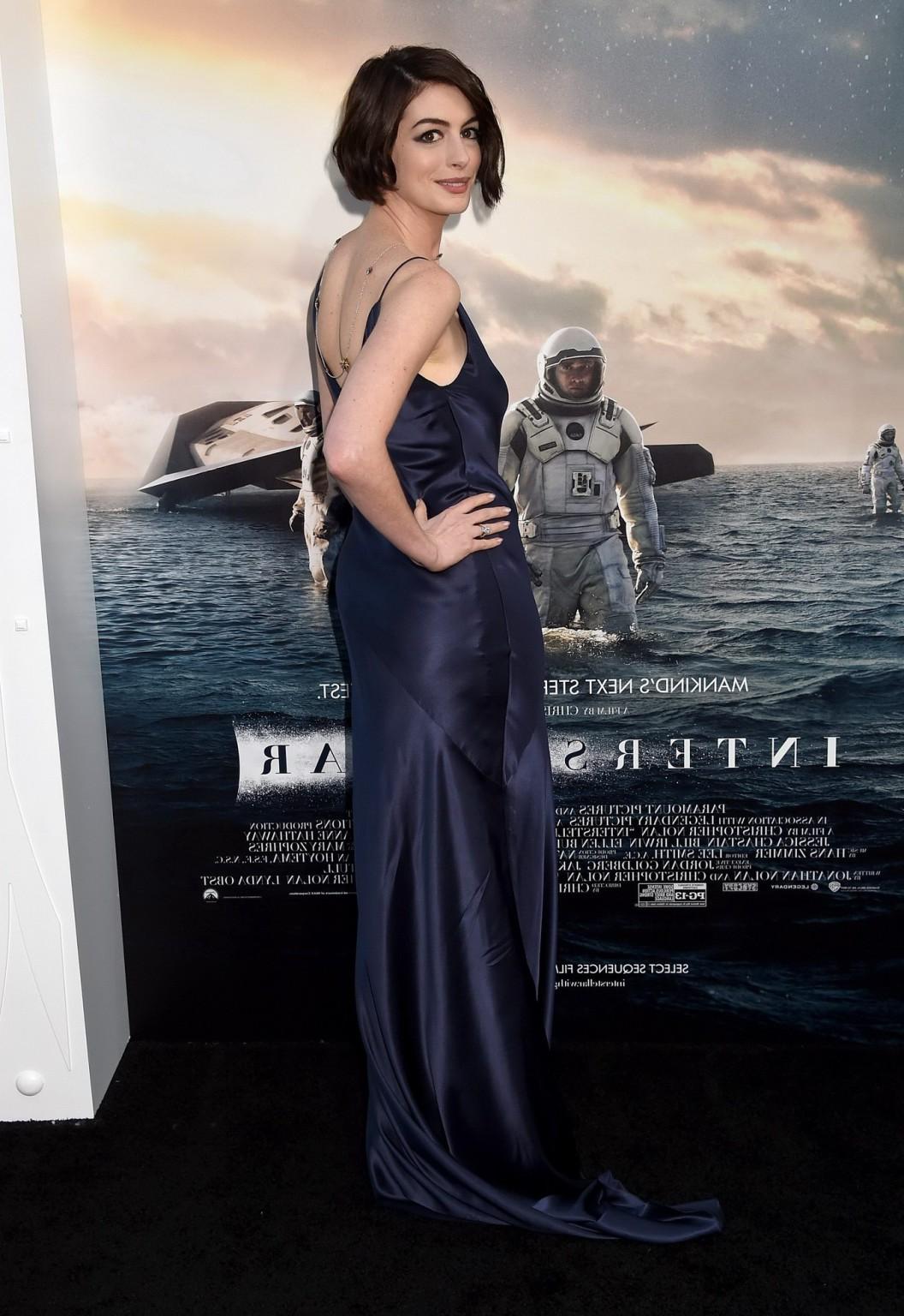 16P Anne Hathaway braless showing big cleavage in a backless purple dress at the Int