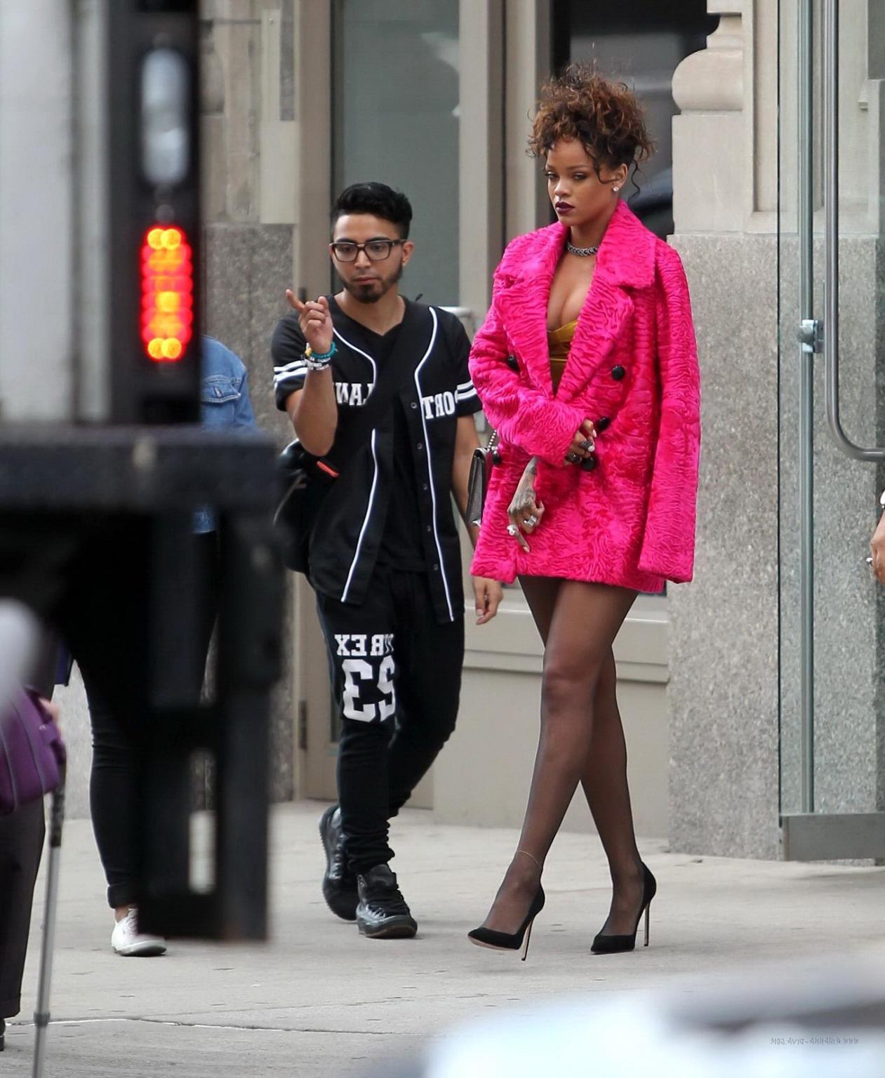 16P Rihanna shows cleavage and legs wearing a little yellow dress outside Nobu resta