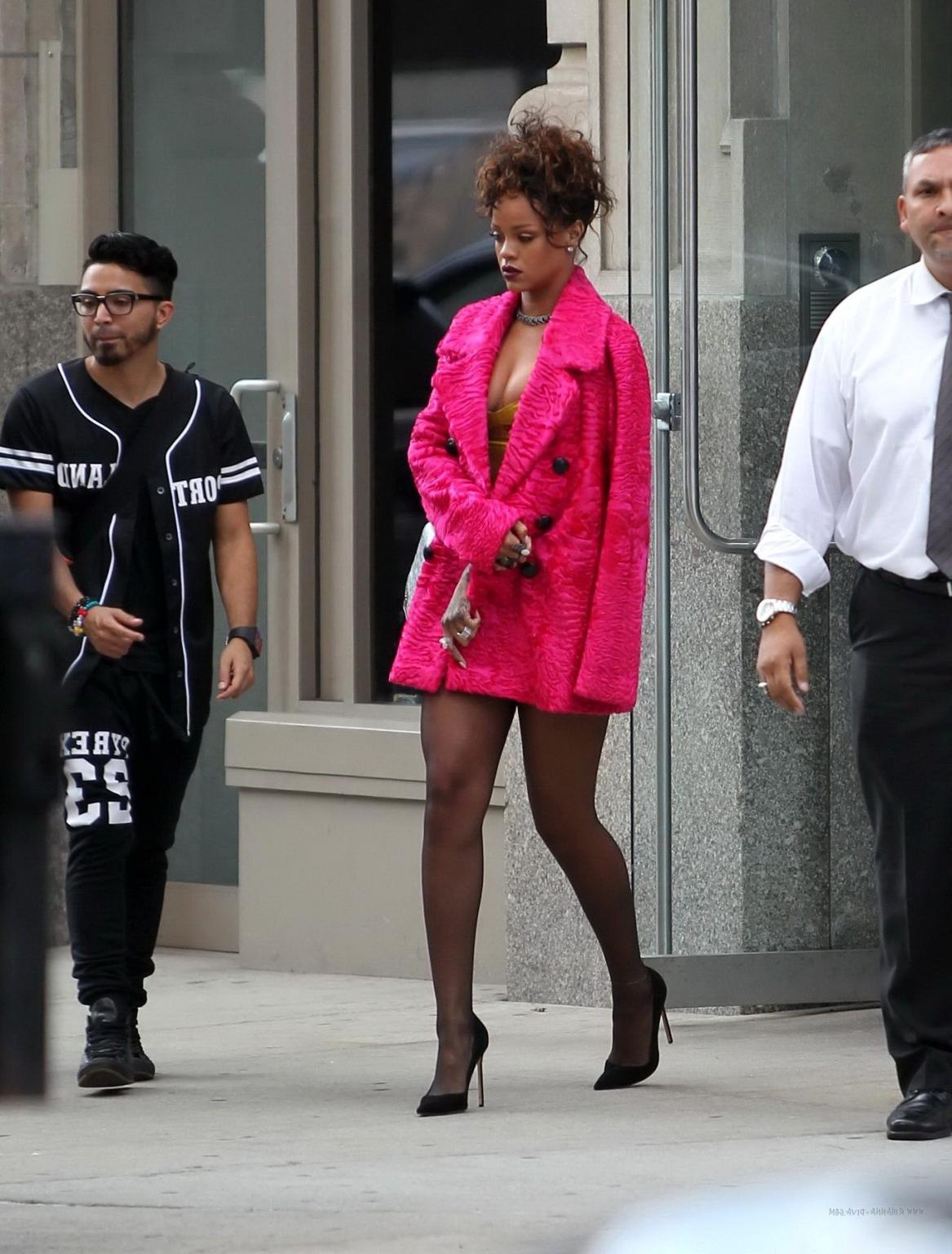 16P Rihanna shows cleavage and legs wearing a little yellow dress outside Nobu resta