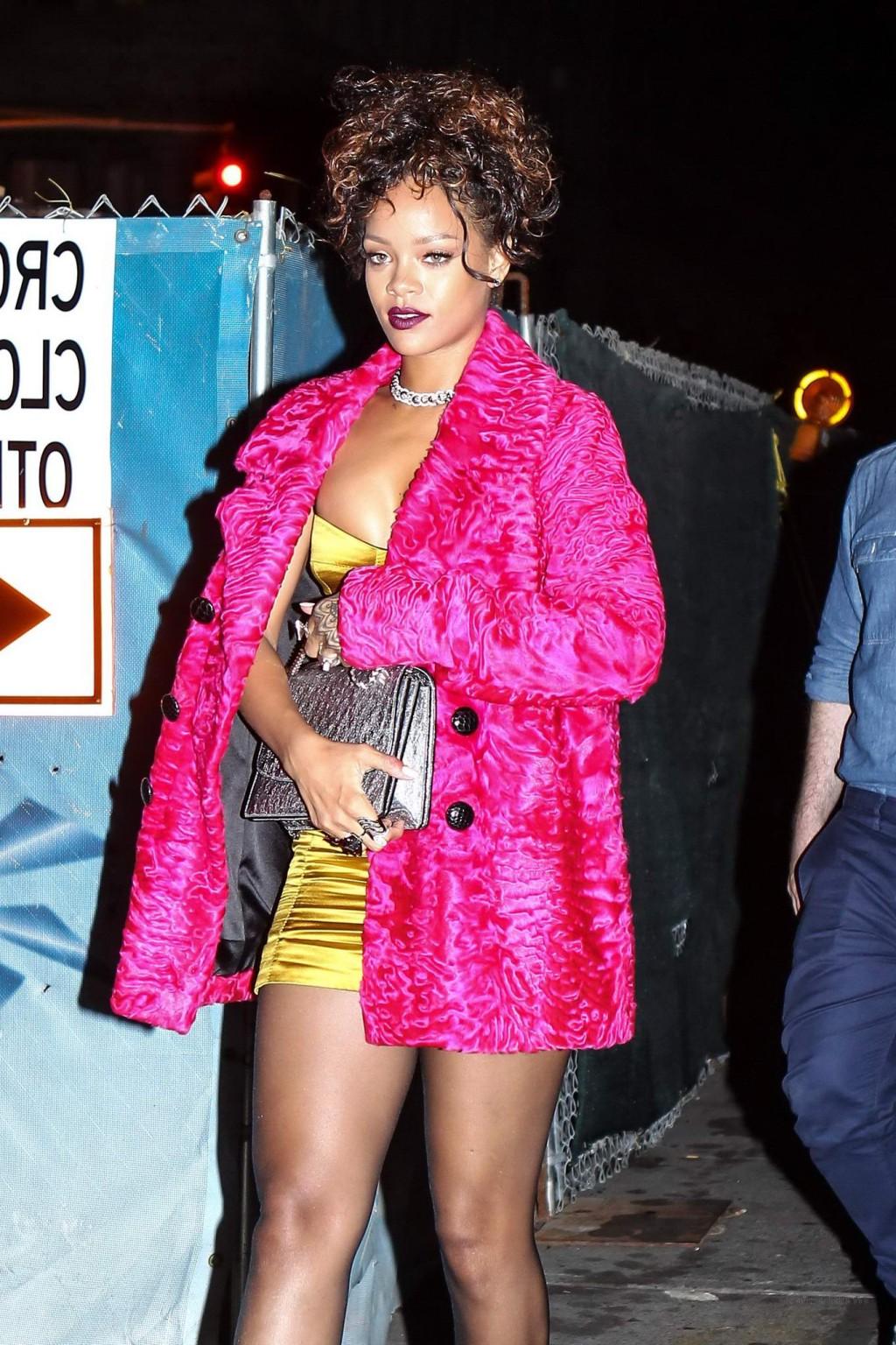 16P Rihanna shows cleavage and legs wearing a little yellow dress outside Nobu resta