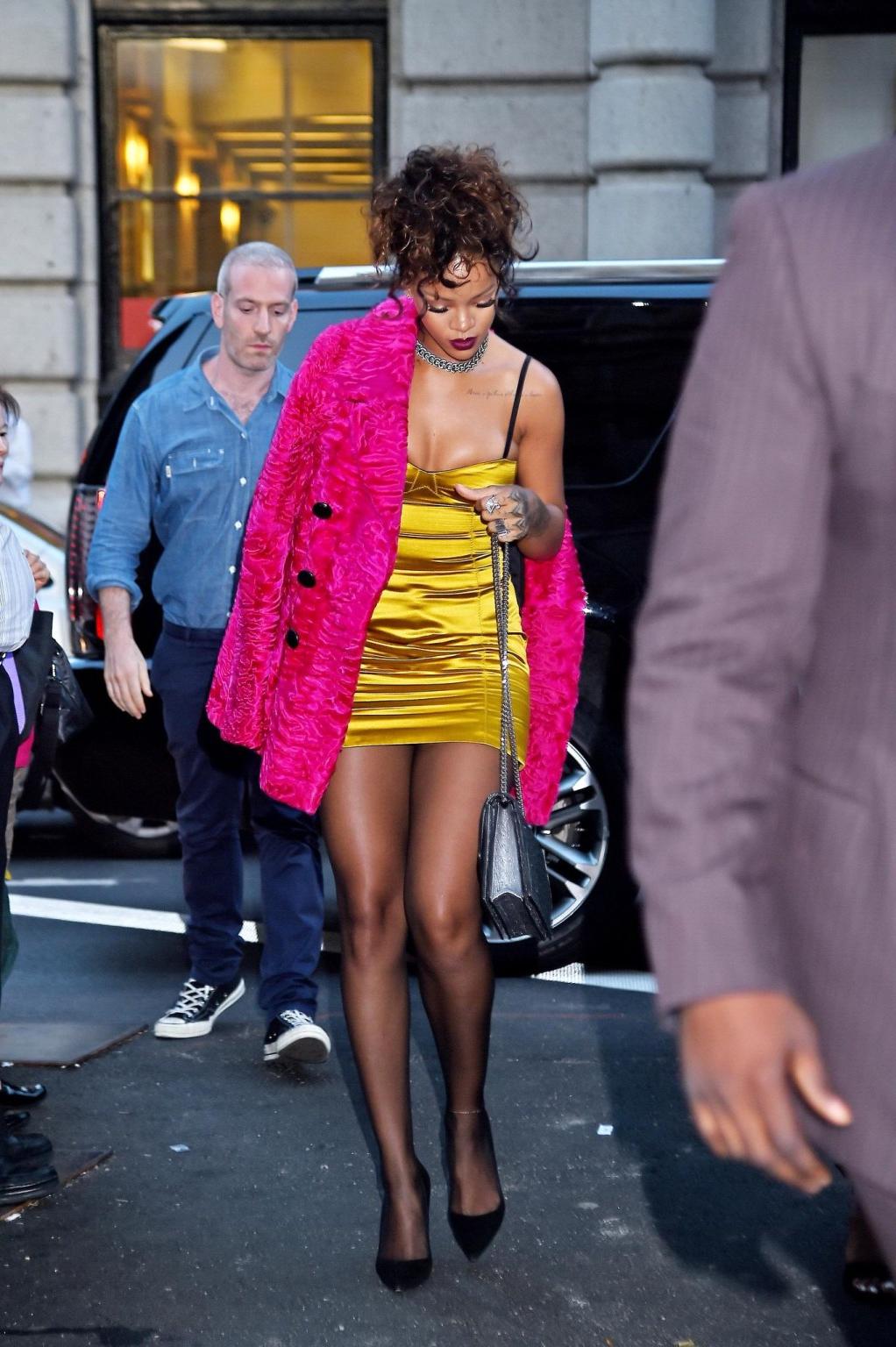 16P Rihanna shows cleavage and legs wearing a little yellow dress outside Nobu resta
