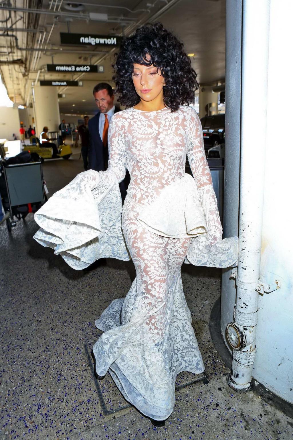 15P Lady Gaga shows off her boobs and ass wearing a see through lace dress at LAX Ai