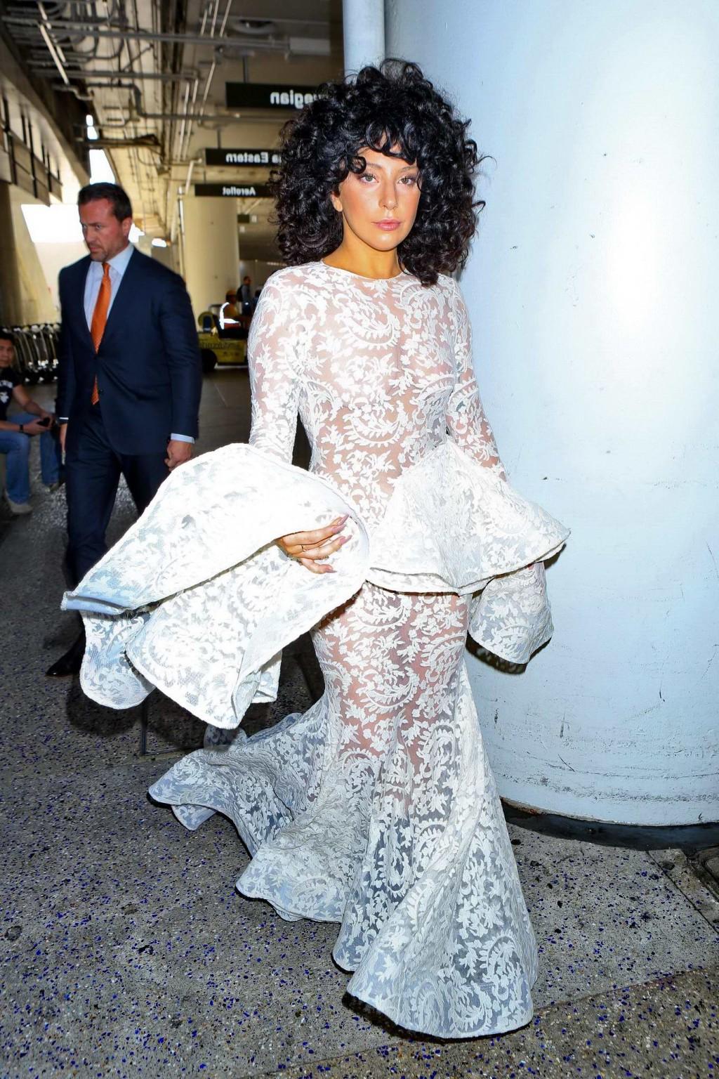 15P Lady Gaga shows off her boobs and ass wearing a see through lace dress at LAX Ai