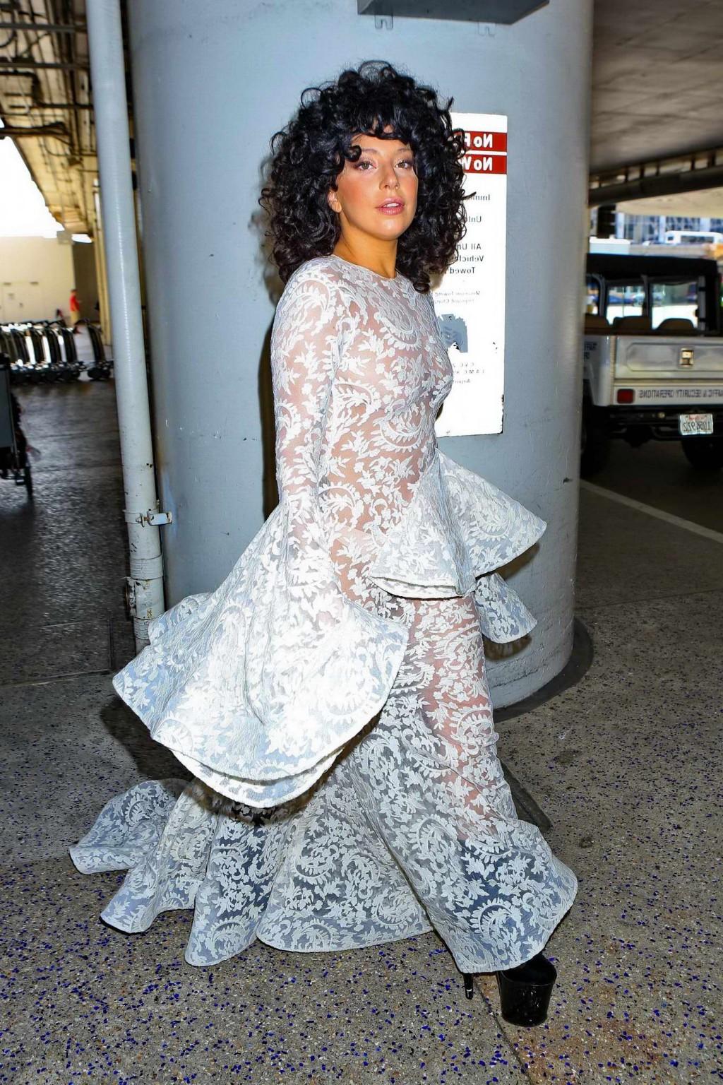 15P Lady Gaga shows off her boobs and ass wearing a see through lace dress at LAX Ai