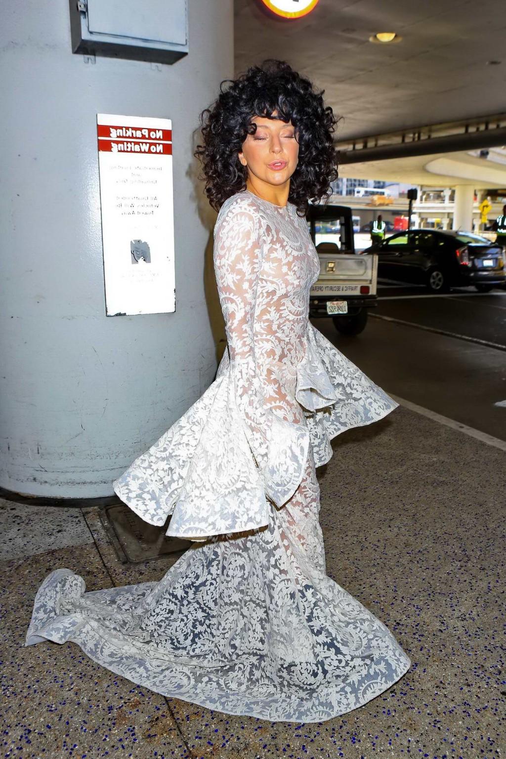 15P Lady Gaga shows off her boobs and ass wearing a see through lace dress at LAX Ai