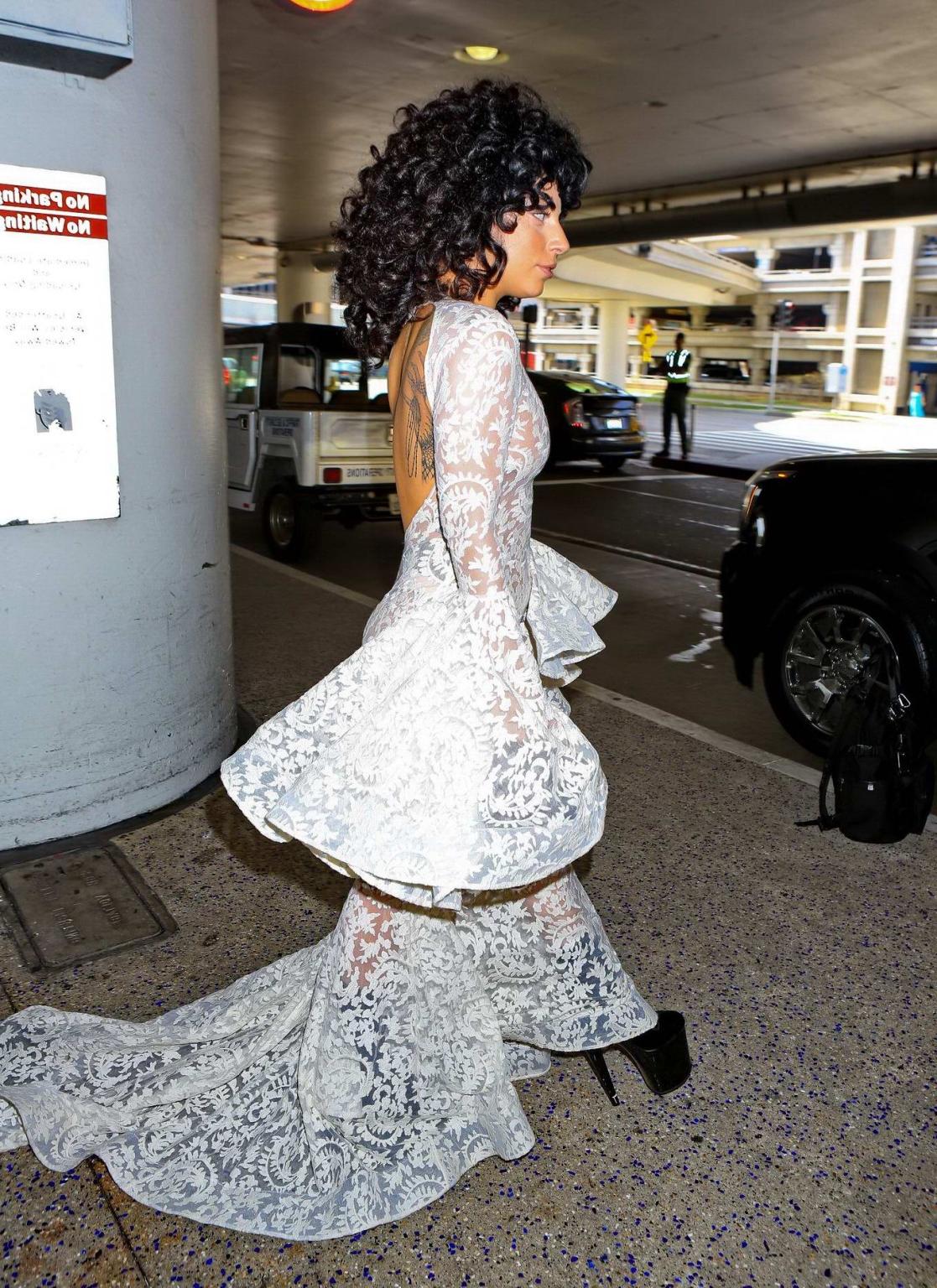15P Lady Gaga shows off her boobs and ass wearing a see through lace dress at LAX Ai