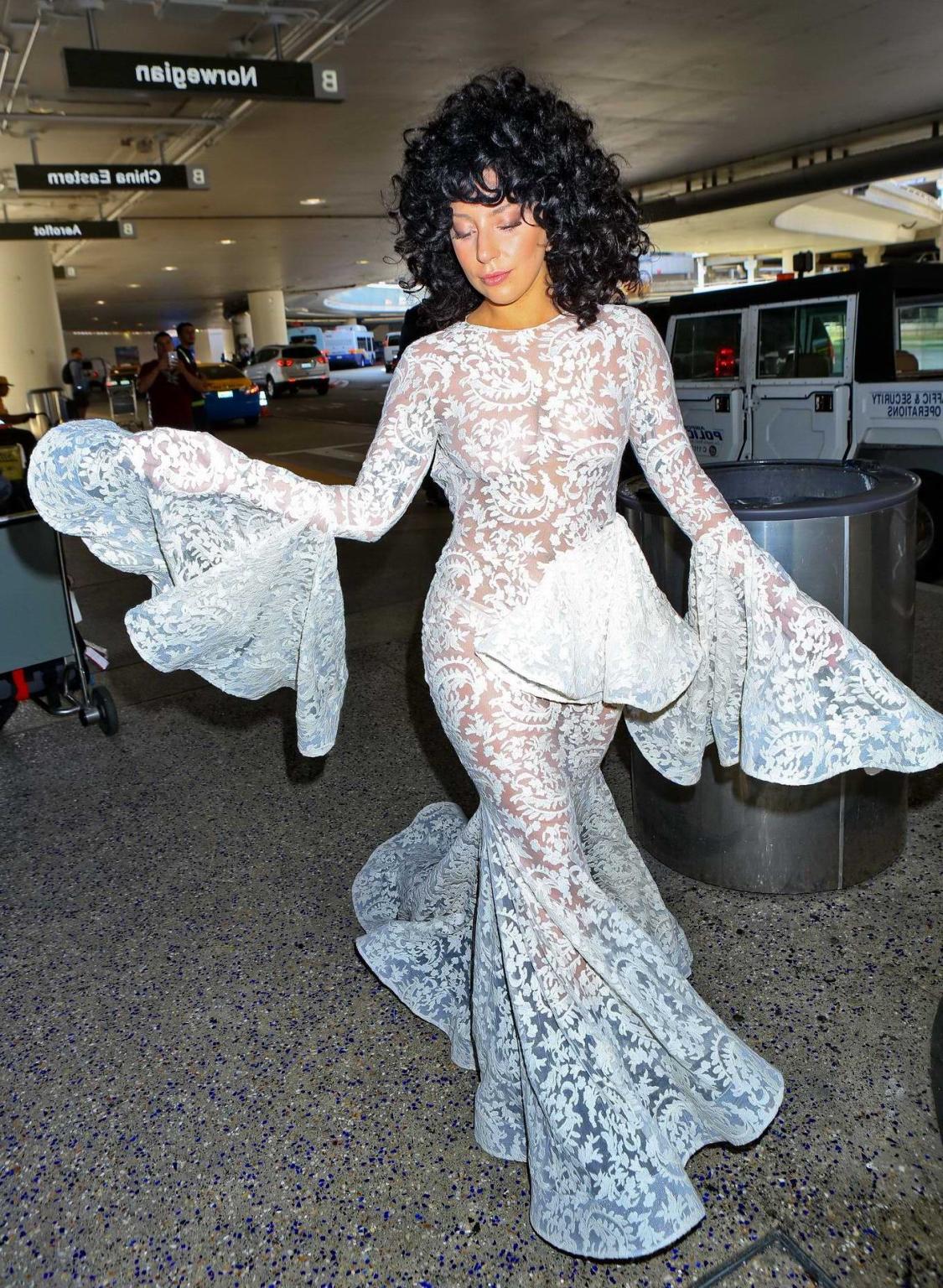 15P Lady Gaga shows off her boobs and ass wearing a see through lace dress at LAX Ai