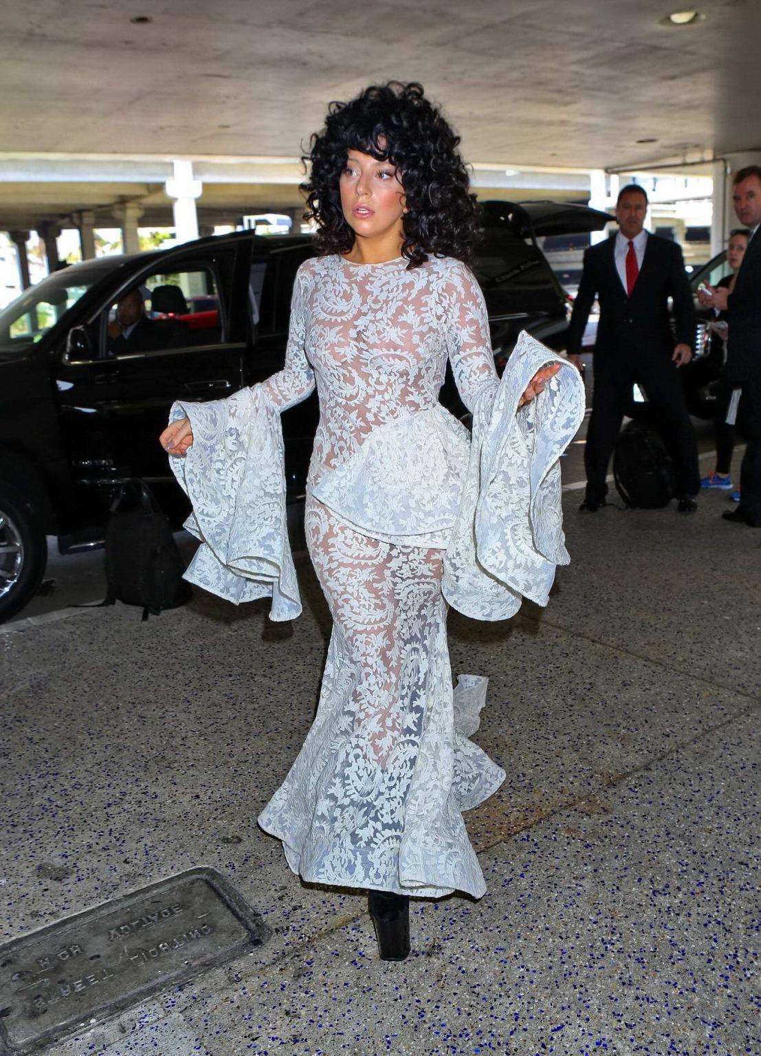 15P Lady Gaga shows off her boobs and ass wearing a see through lace dress at LAX Ai