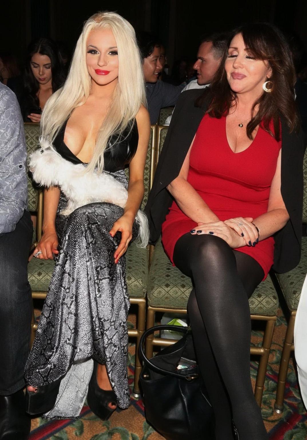 16P Courtney Stodden nipple slip in a low cut snake print dress at the Art Loves Fas