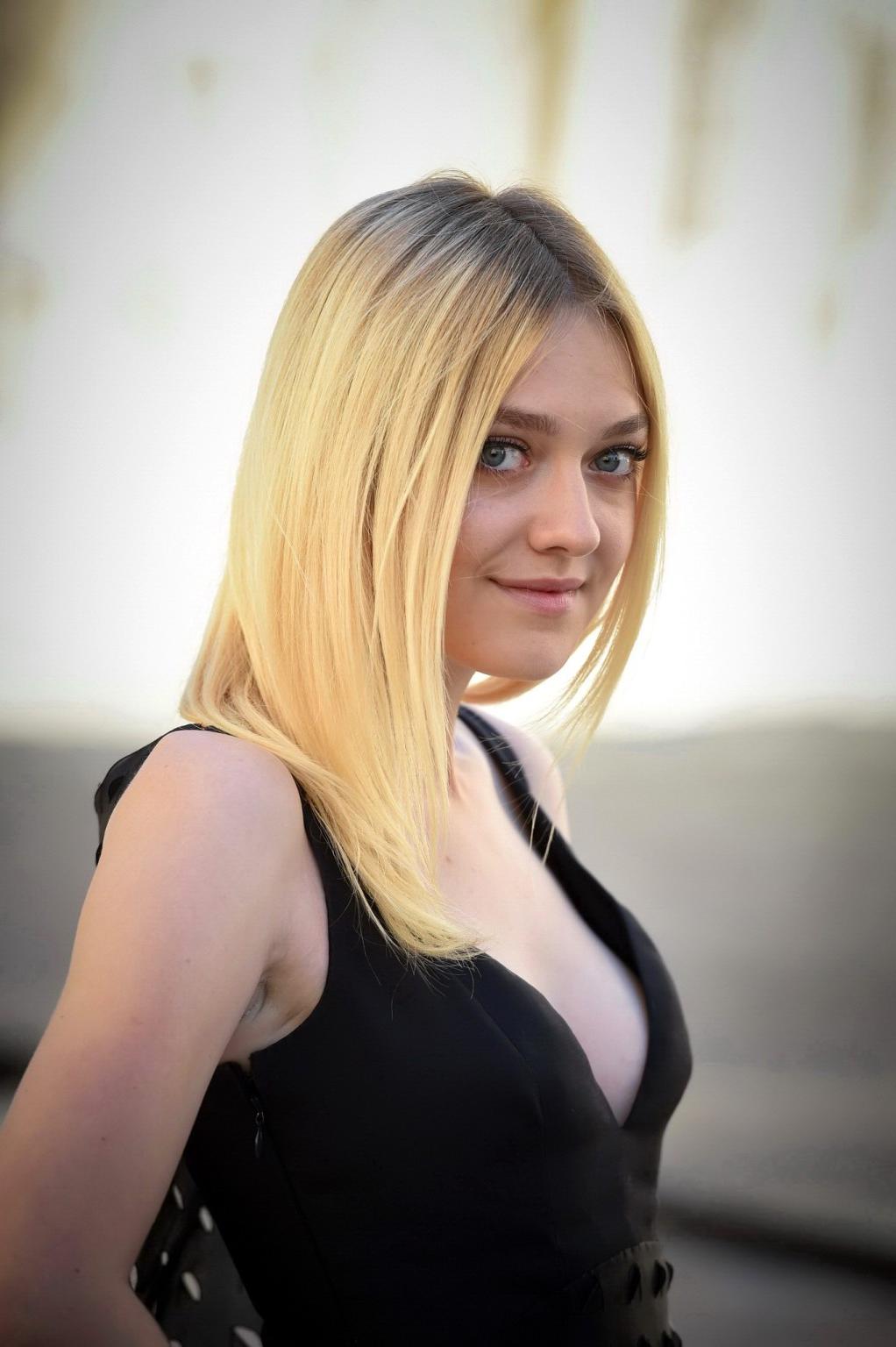 16P Dakota Fanning showing cleavage at the Christian Dior show during Paris Fashion 