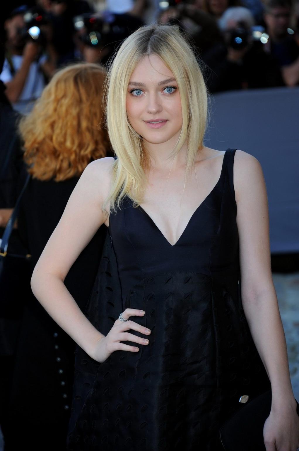 16P Dakota Fanning showing cleavage at the Christian Dior show during Paris Fashion 