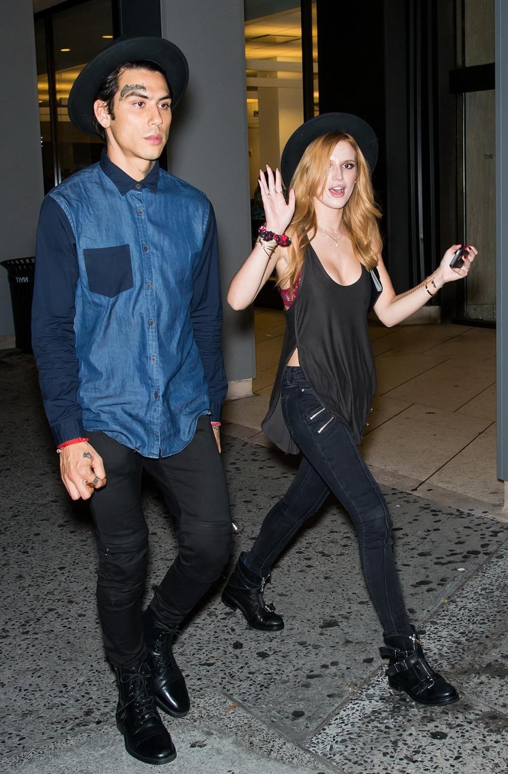 10P Bella Thorne showing big cleavage in a black top and tight jeans out in NYC