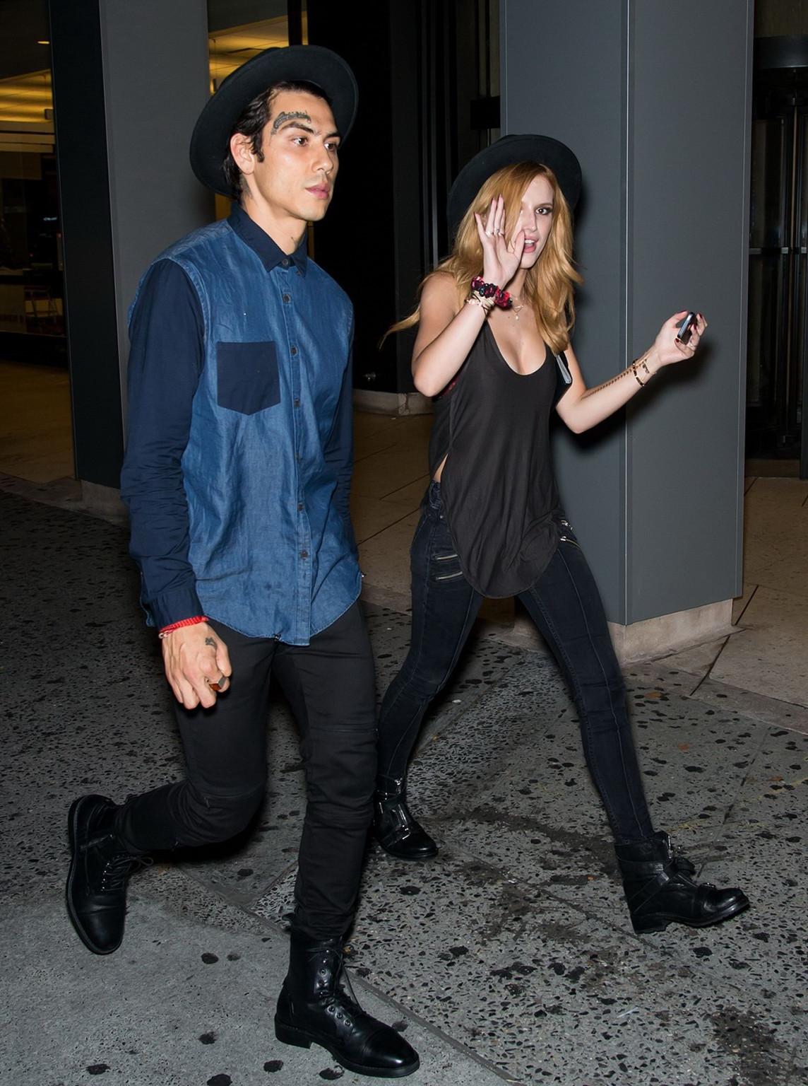 10P Bella Thorne showing big cleavage in a black top and tight jeans out in NYC