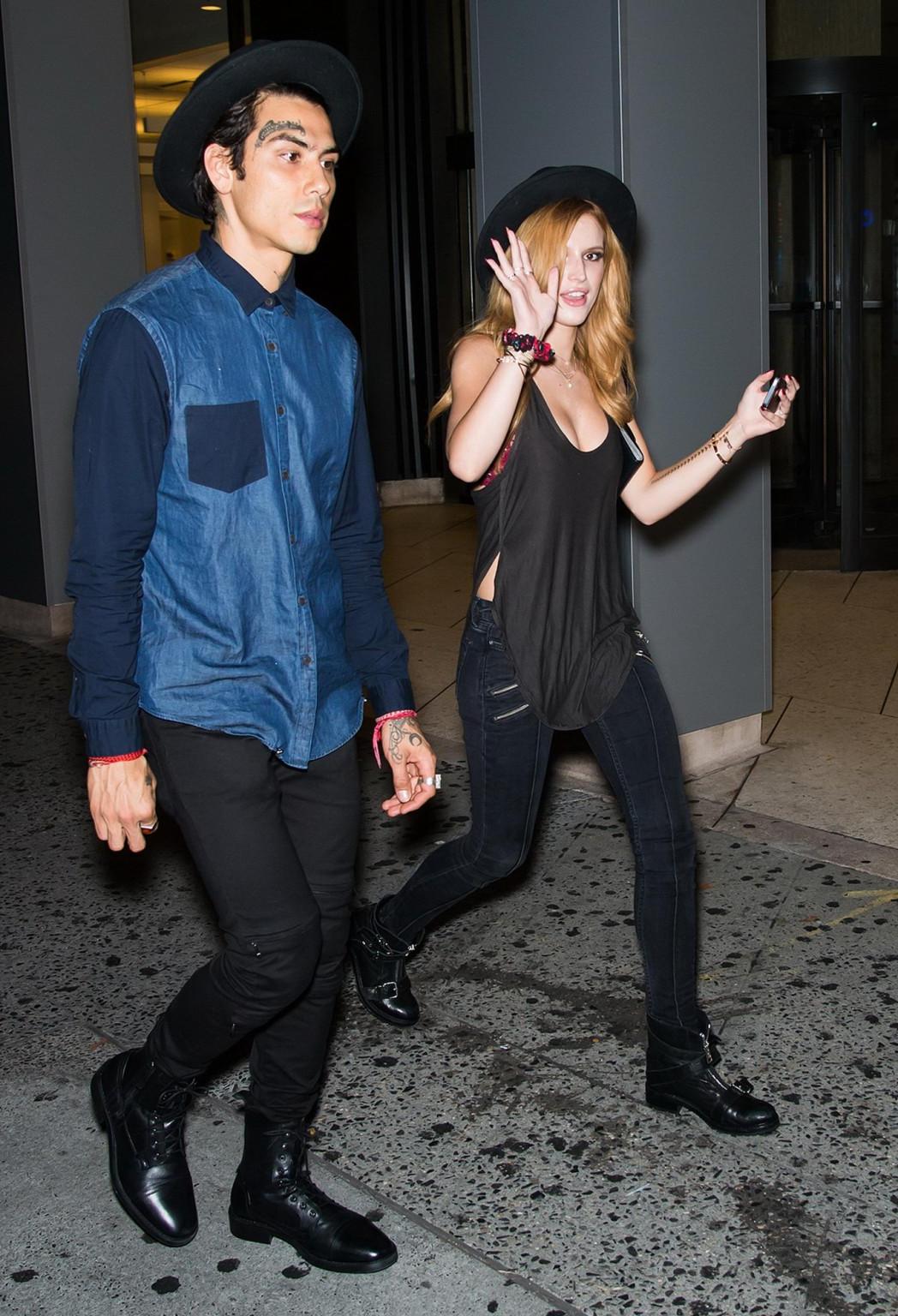 10P Bella Thorne showing big cleavage in a black top and tight jeans out in NYC