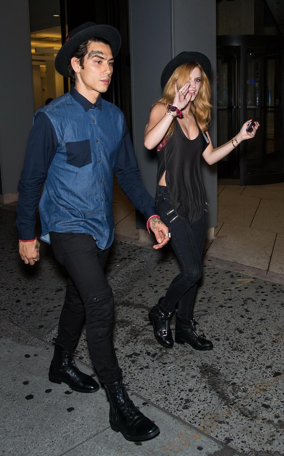 10P Bella Thorne showing big cleavage in a black top and tight jeans out in NYC