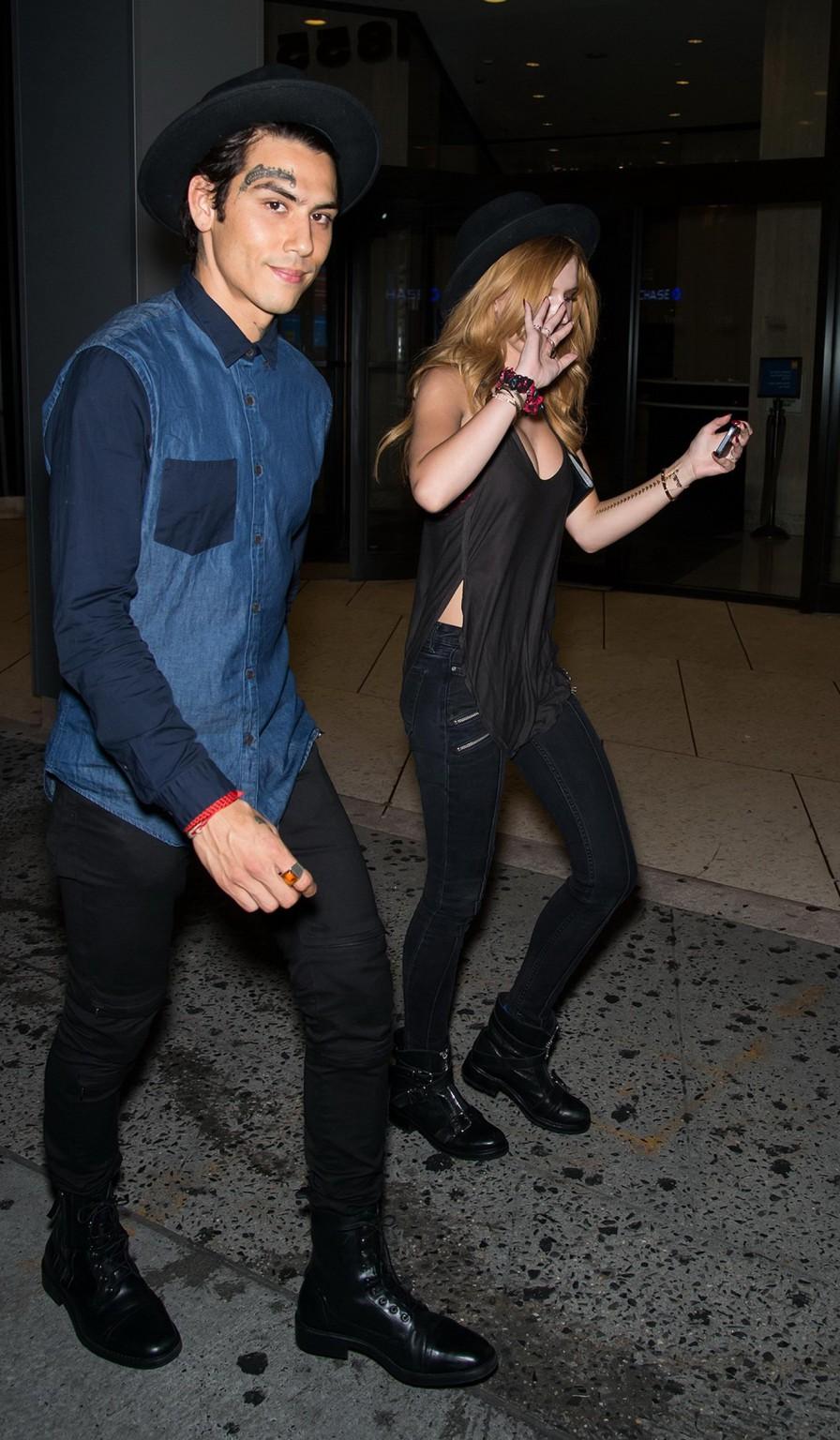 10P Bella Thorne showing big cleavage in a black top and tight jeans out in NYC