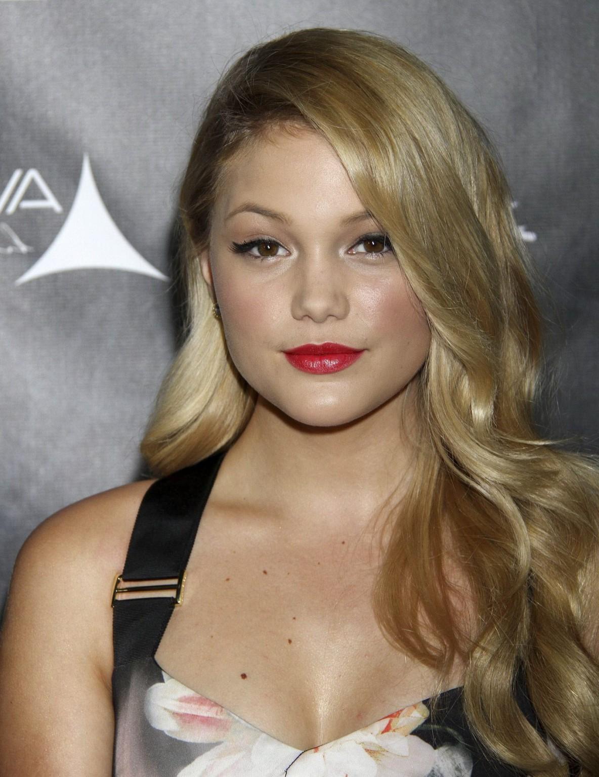 16P Olivia Holt showing big cleavage in a tight floral dress for the Industry Dance 