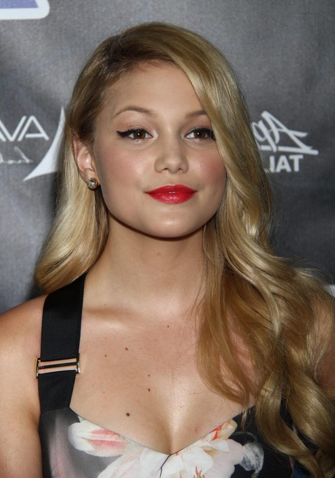 16P Olivia Holt showing big cleavage in a tight floral dress for the Industry Dance 
