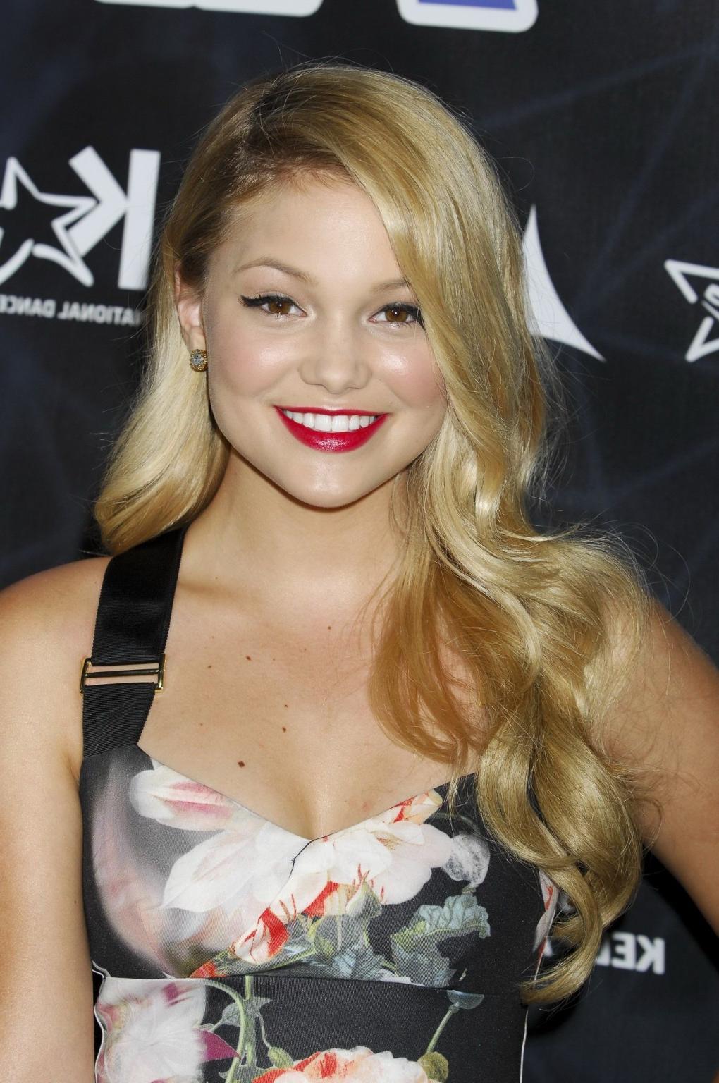 16P Olivia Holt showing big cleavage in a tight floral dress for the Industry Dance 