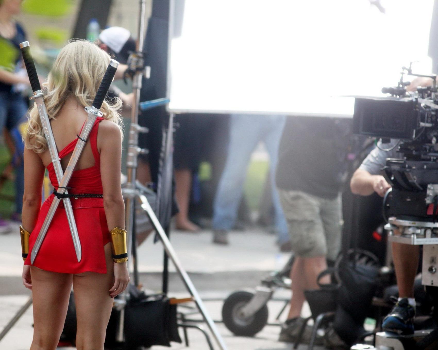 16P Ashley Benson shows off her ass and cleavage wearing a skimpy red outfit on the 
