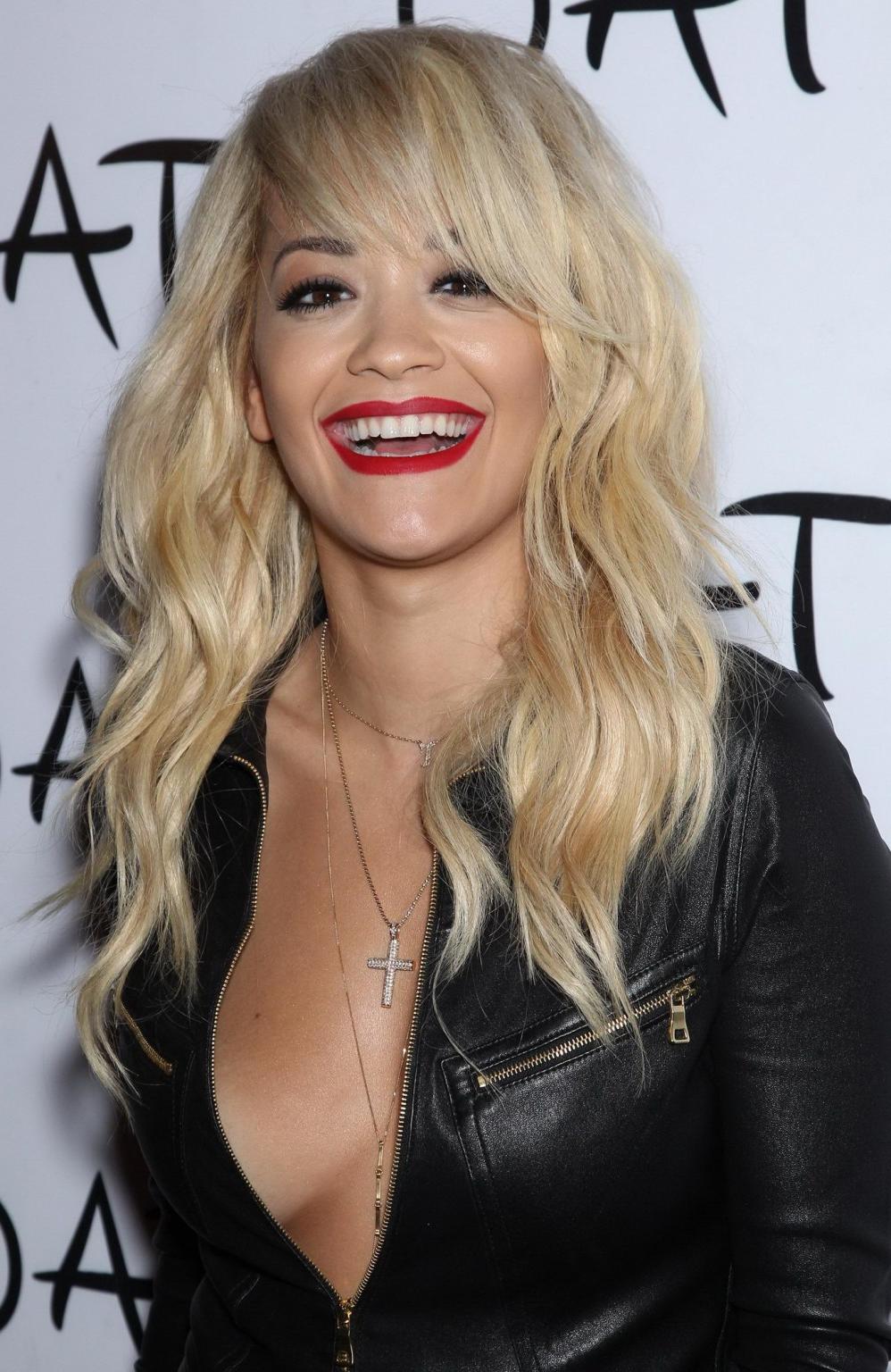 14P Rita Ora shows off her ass and cleavage wearing a black leather jumpsuit at Tao 