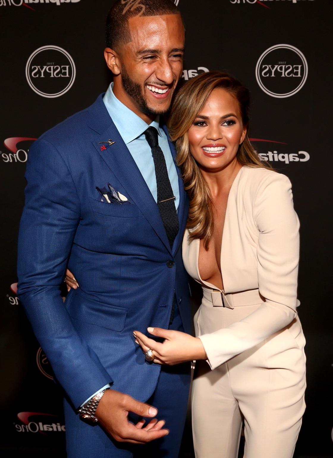 15P Chrissy Teigen braless shows huge cleavage wearing a wide open jumpsuit for the 