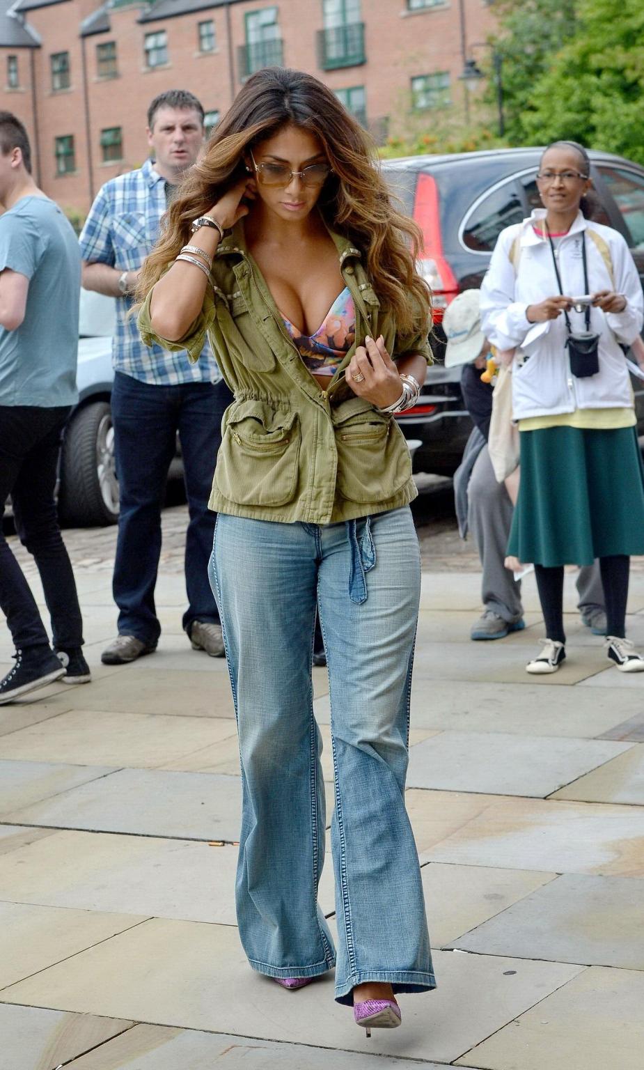 16P Nicole Scherzinger shows huge cleavage heading to Key 103 Radio in London Englan