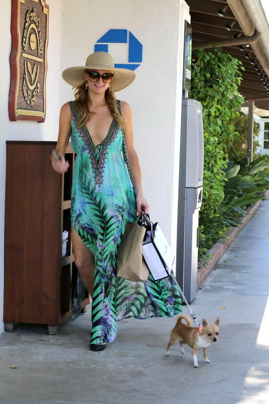 16P Paris Hilton braless showing huge cleavage out in Malibu