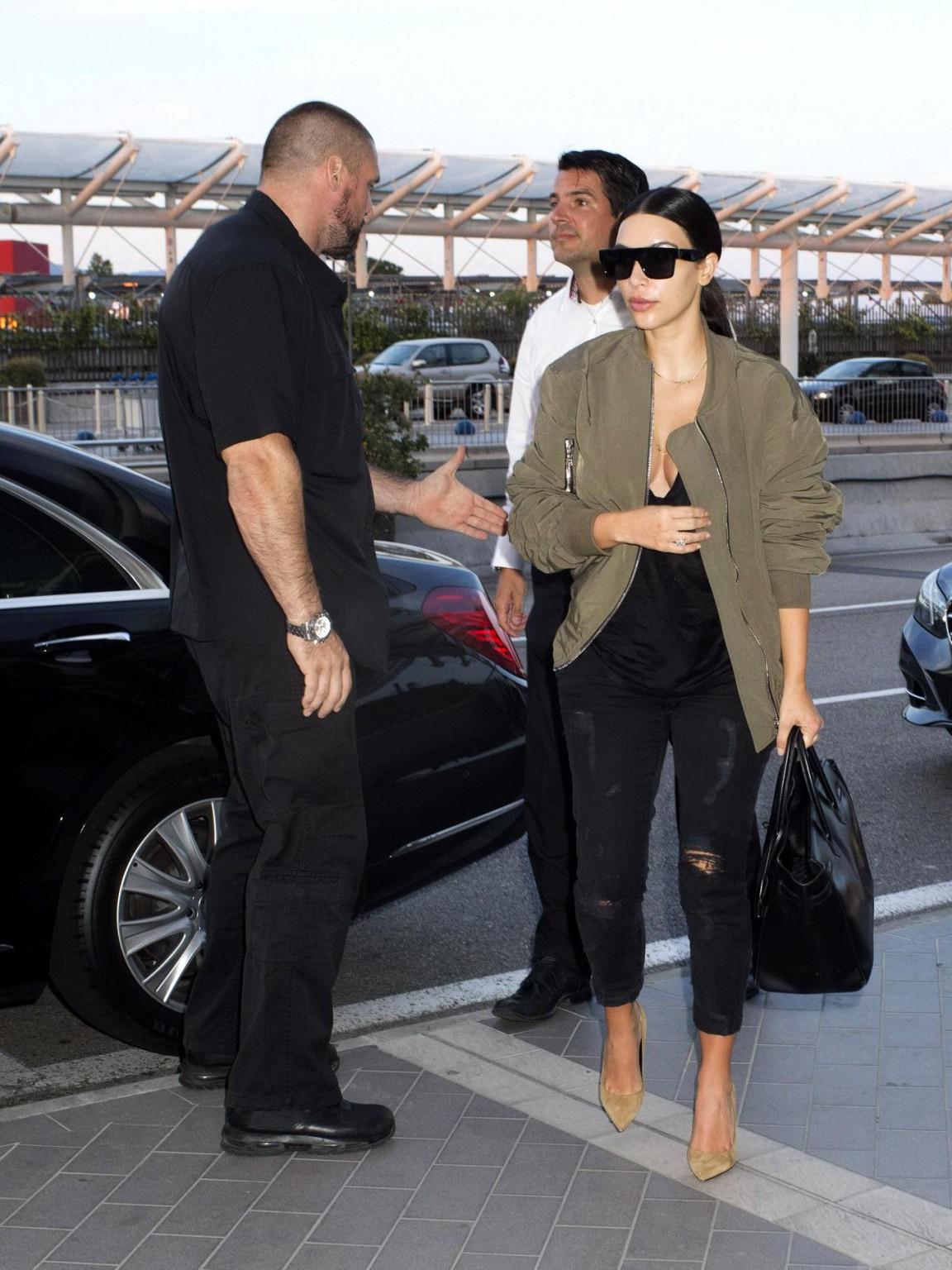 16P Kim Kardashian showing huge cleavage at Nice Airport in France