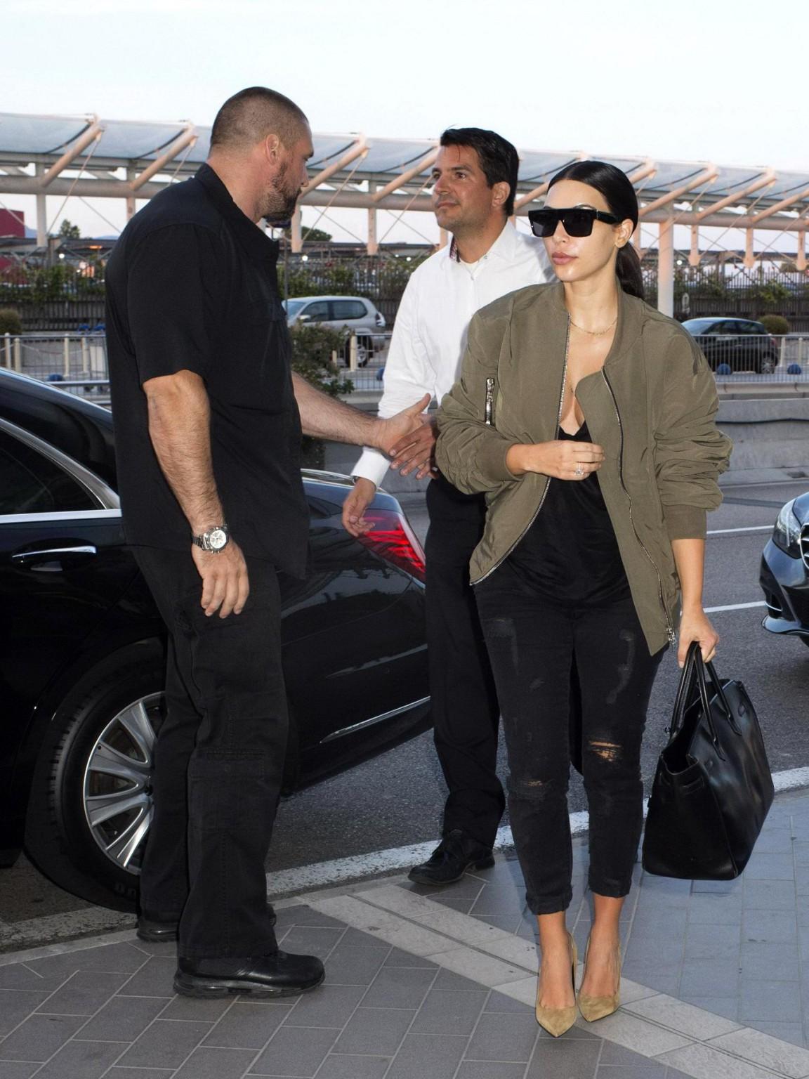 16P Kim Kardashian showing huge cleavage at Nice Airport in France