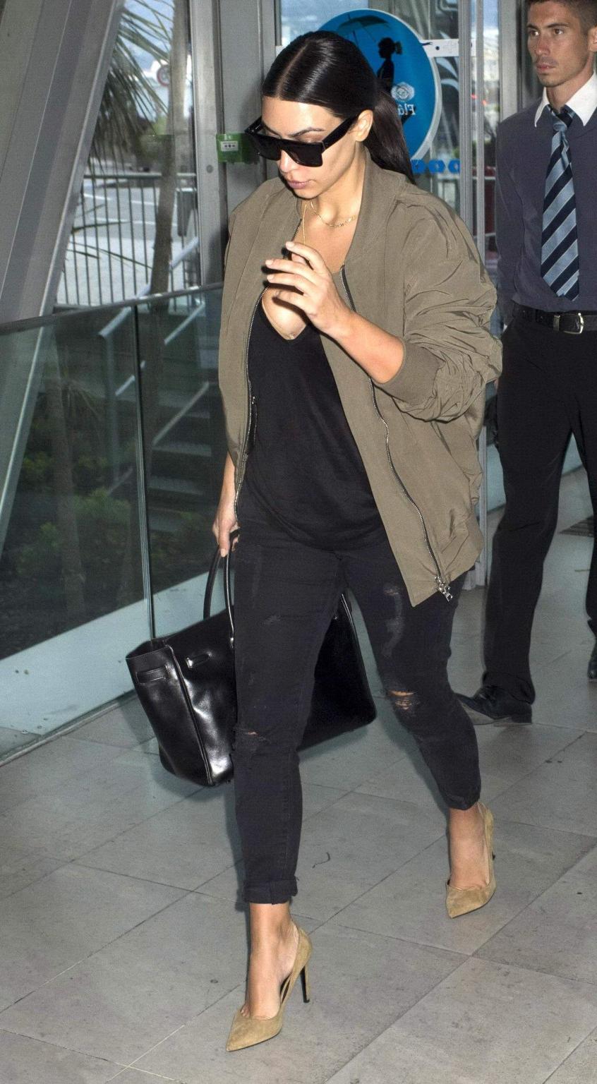 16P Kim Kardashian showing huge cleavage at Nice Airport in France