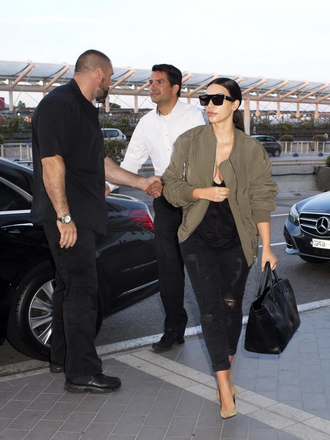 16P Kim Kardashian showing huge cleavage at Nice Airport in France