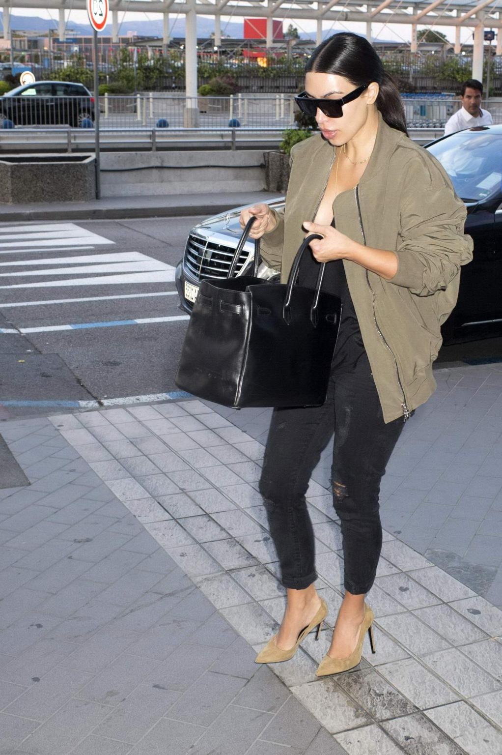 16P Kim Kardashian showing huge cleavage at Nice Airport in France