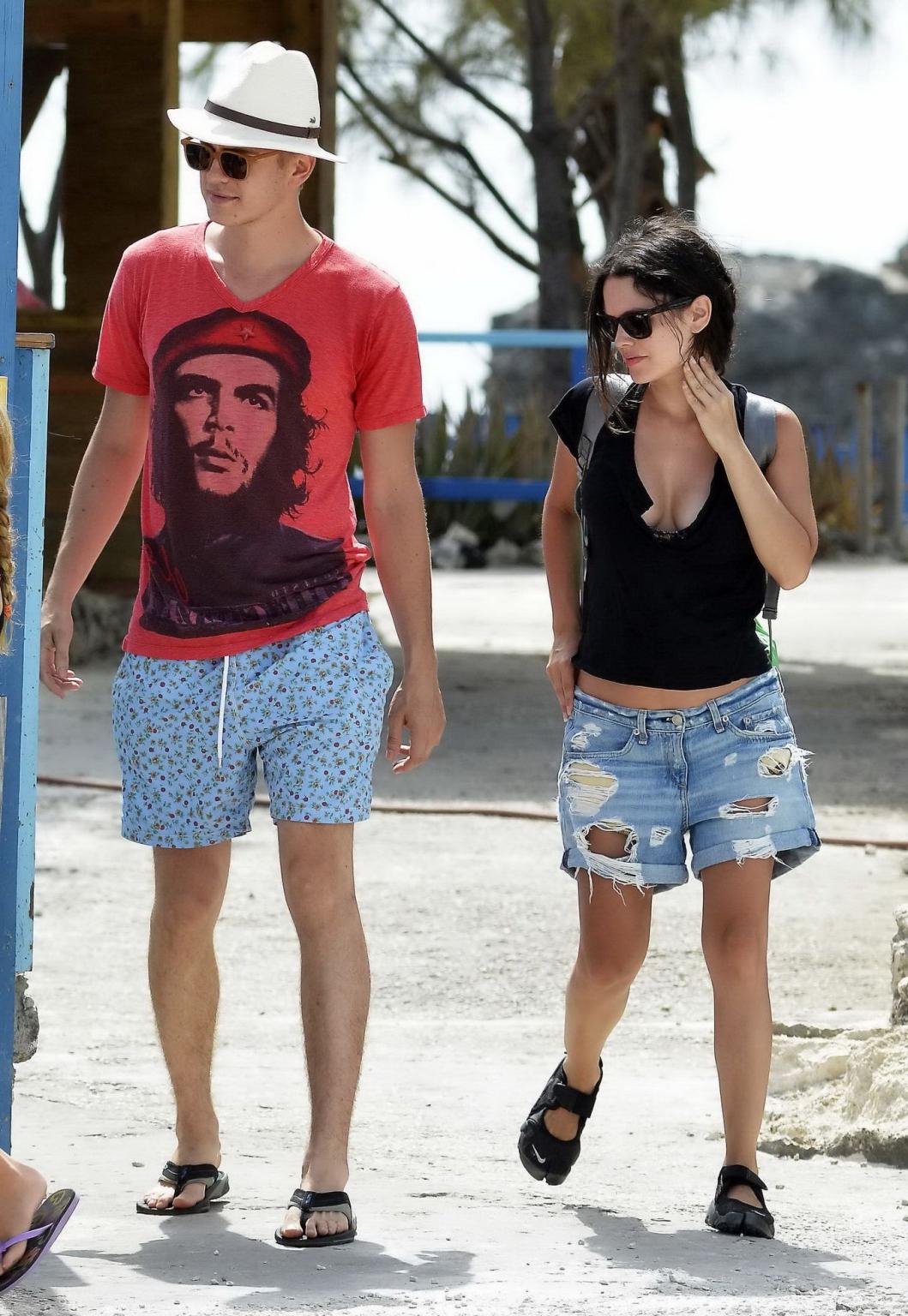 16P Rachel Bilson showing huge cleavage in black top and ripped denim shorts in Barb