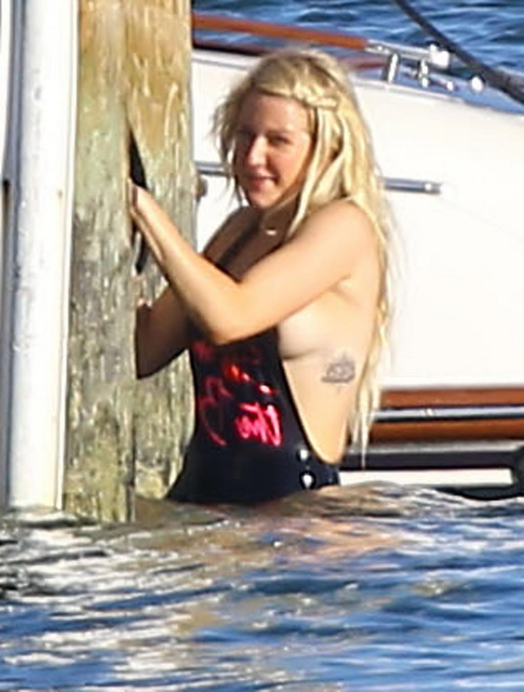16P Ellie Goulding boob slip in black monokini during a vacation in Miami Beach