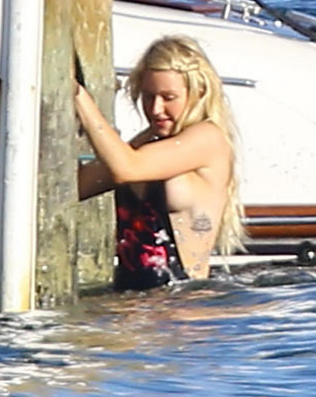 16P Ellie Goulding boob slip in black monokini during a vacation in Miami Beach