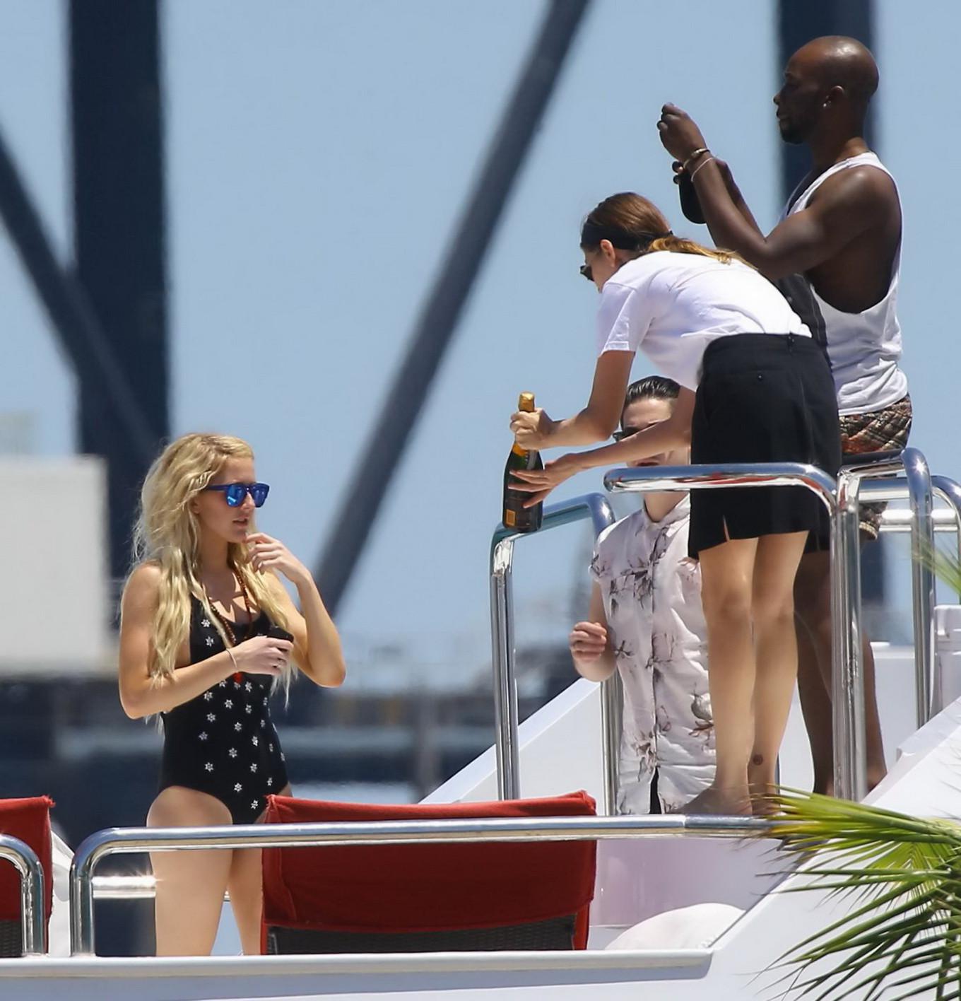 16P Ellie Goulding boob slip in black monokini during a vacation in Miami Beach