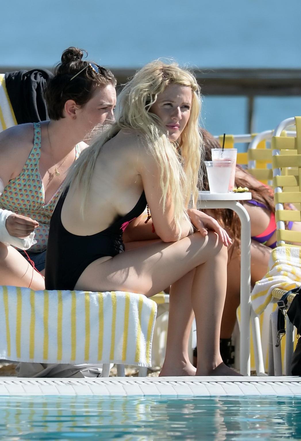 16P Ellie Goulding boob slip in black monokini during a vacation in Miami Beach