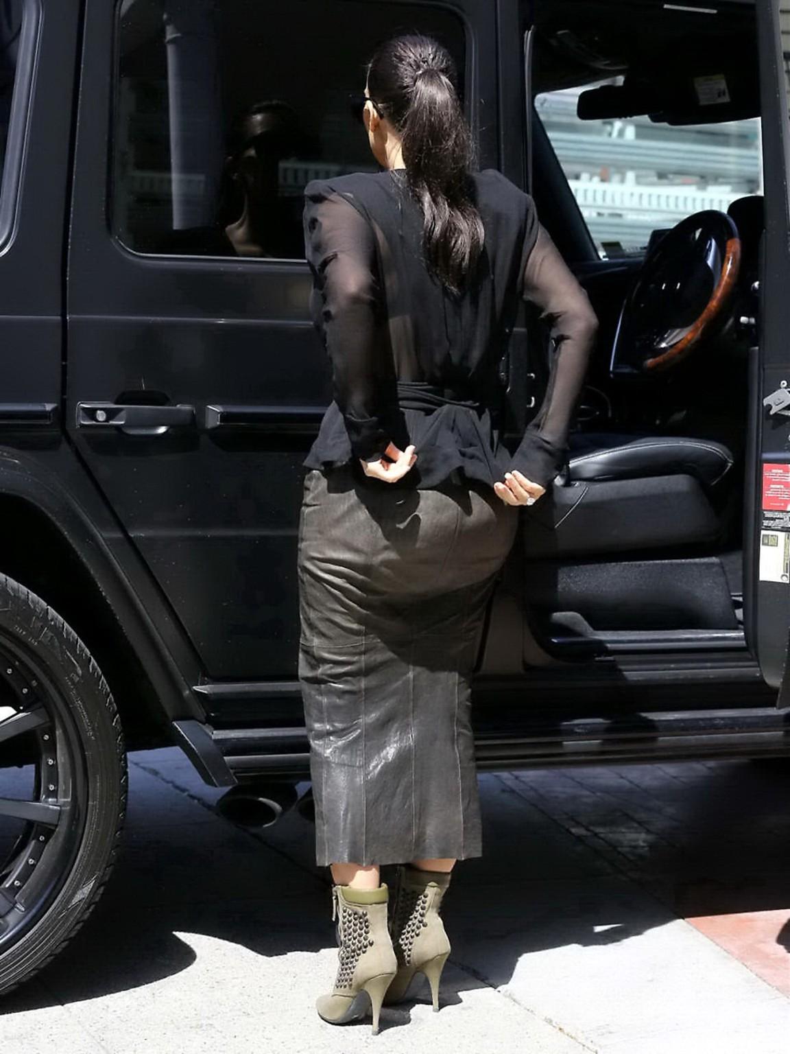 16P Kim Kardashian shows cleavage and booty while shopping at Canyon Beachwear