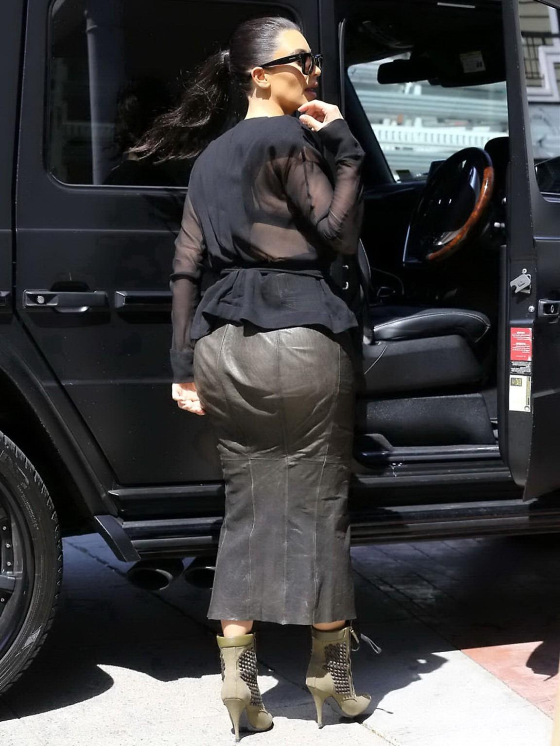 16P Kim Kardashian shows cleavage and booty while shopping at Canyon Beachwear