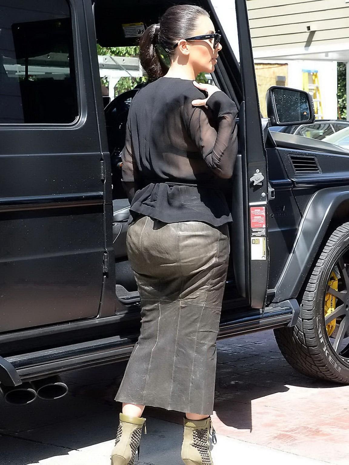 16P Kim Kardashian shows cleavage and booty while shopping at Canyon Beachwear
