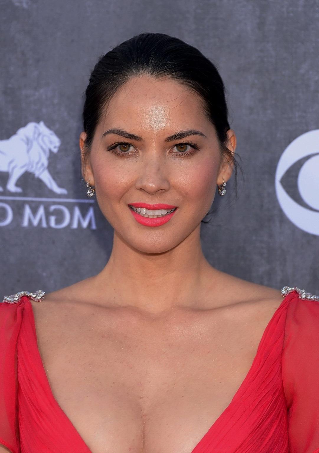 16P Olivia Munn braless showing huge cleavage in high slit red dress