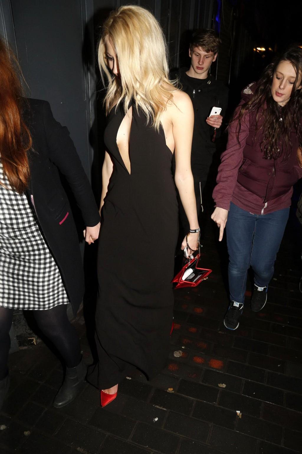 16P Pixie Lott braless shows cleavage leaving the Universal BRITs 2014 After-Party i