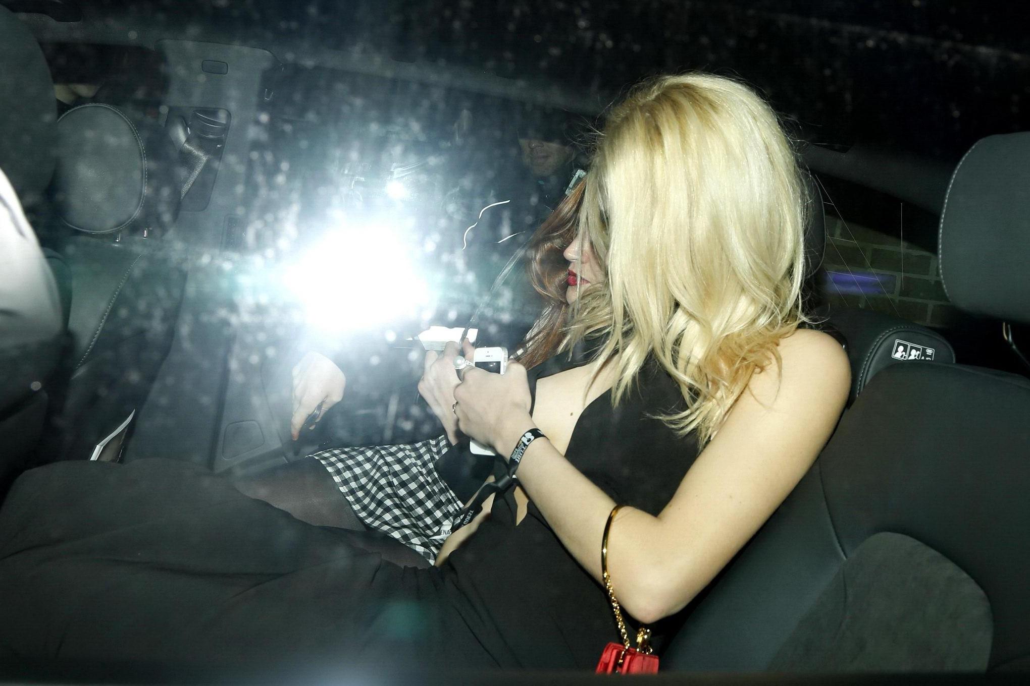 16P Pixie Lott braless shows cleavage leaving the Universal BRITs 2014 After-Party i