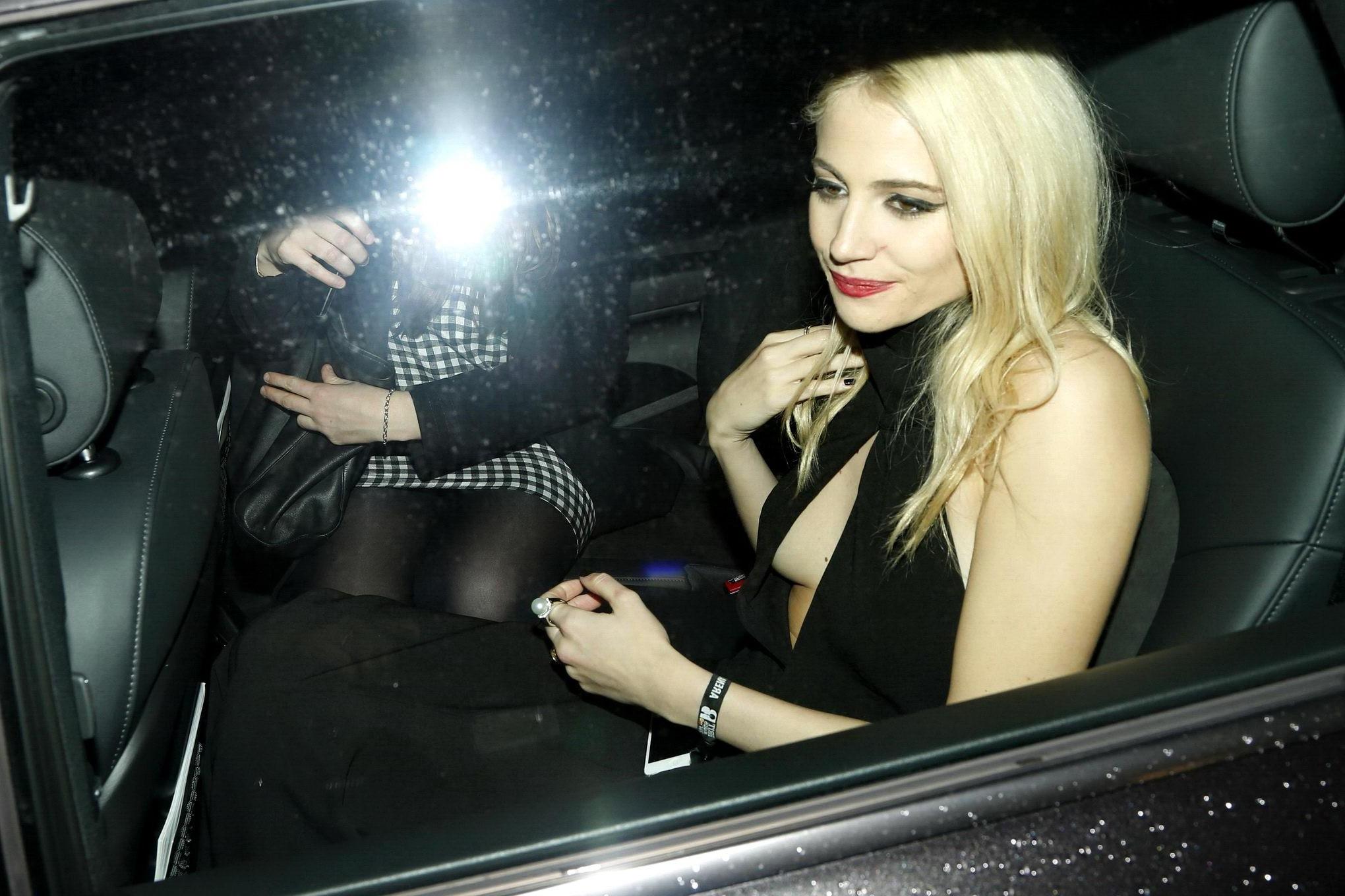 16P Pixie Lott braless shows cleavage leaving the Universal BRITs 2014 After-Party i