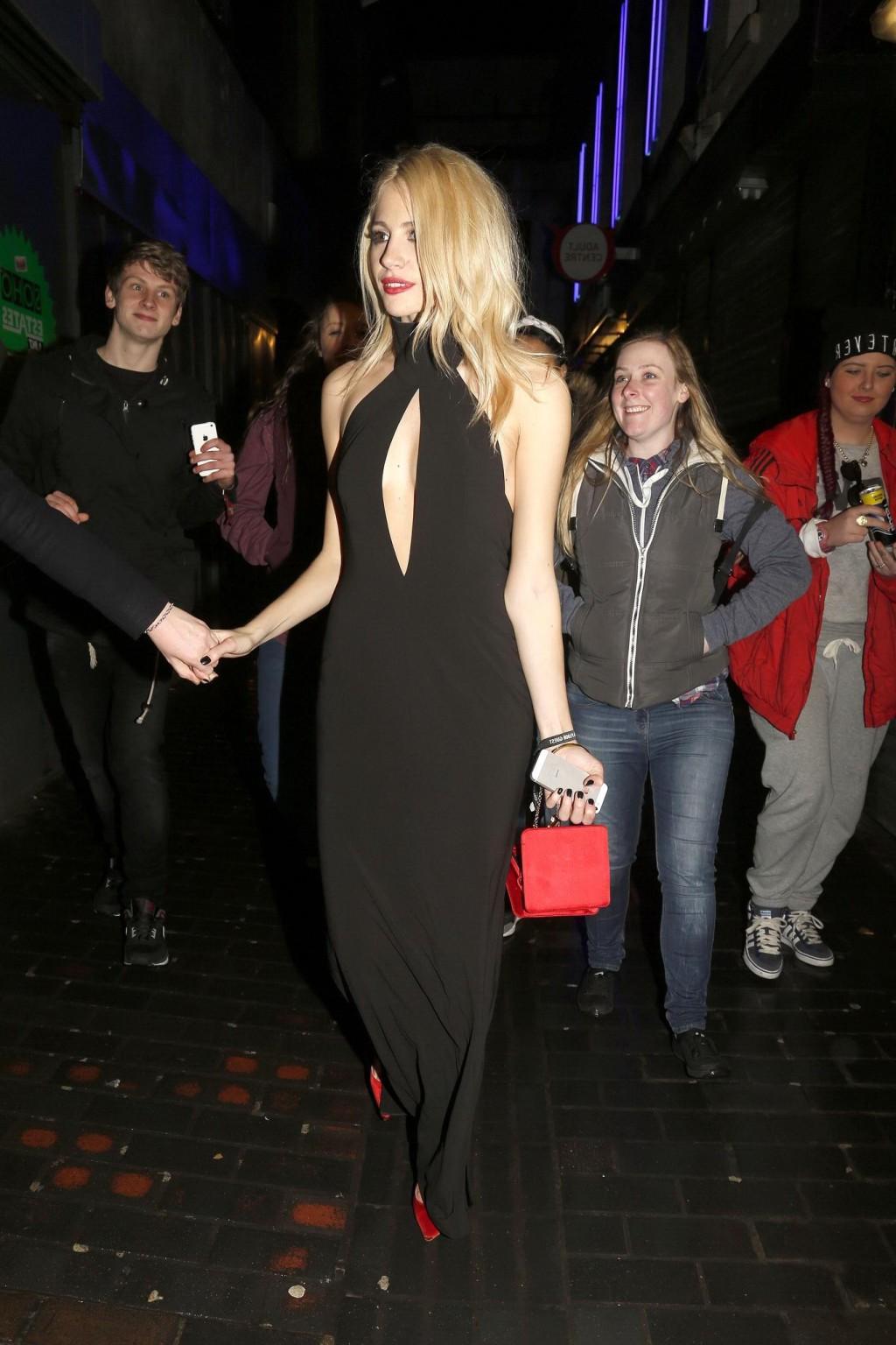 16P Pixie Lott braless shows cleavage leaving the Universal BRITs 2014 After-Party i