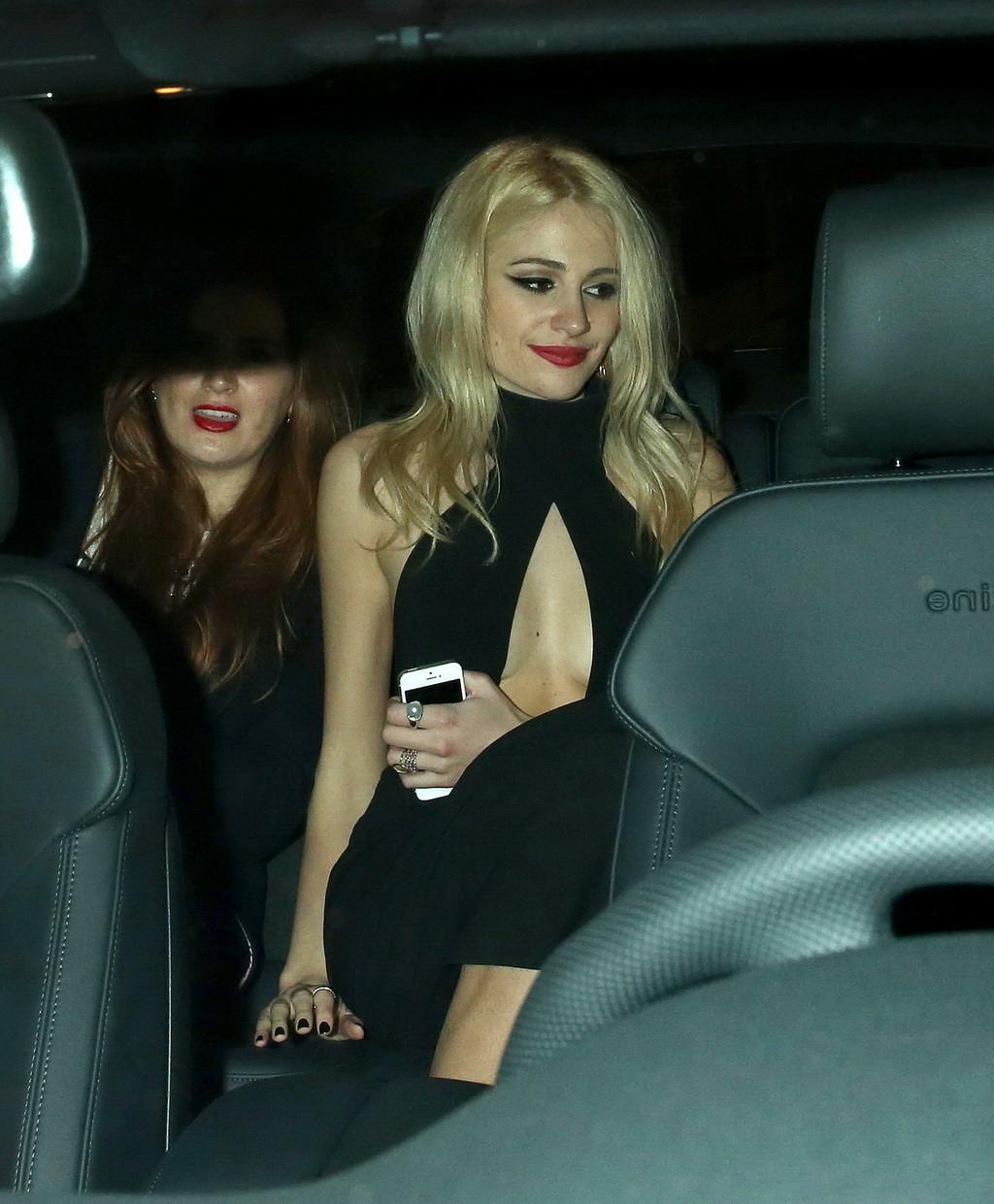 16P Pixie Lott braless shows cleavage leaving the Universal BRITs 2014 After-Party i
