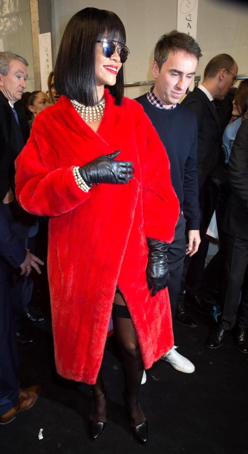 16P Rihanna showing off her stockings and cleavage at the Christian Dior fashion sho